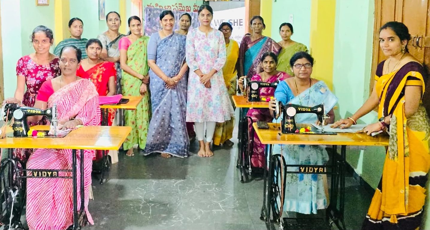 The first batch of trainees at their sewing machines with the founder and the foundation's president